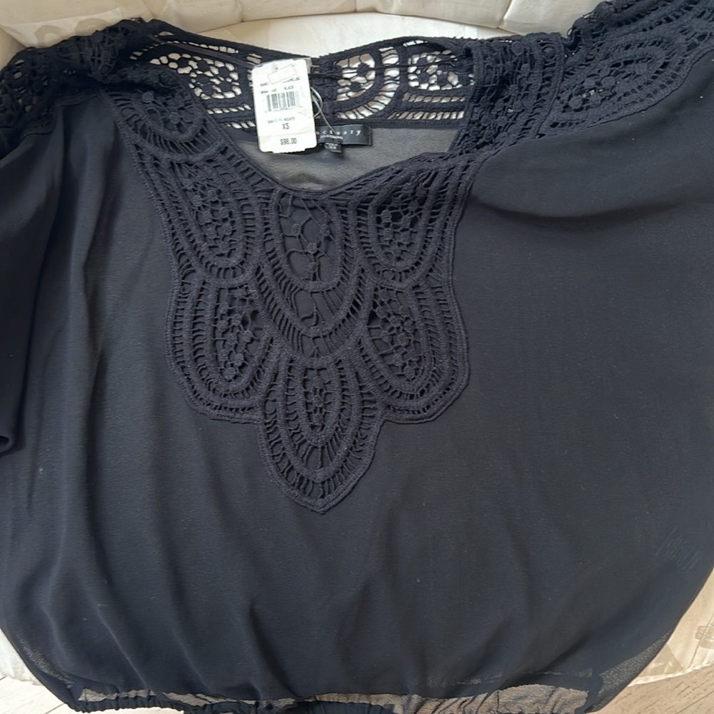 Sheer black wide elbow sleeve top.